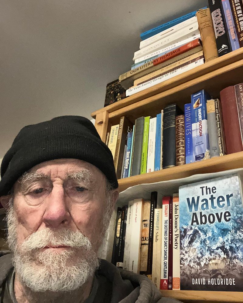 David Holdridge at home in Westfield, Vermont, with The Water Above on the shelf behind him